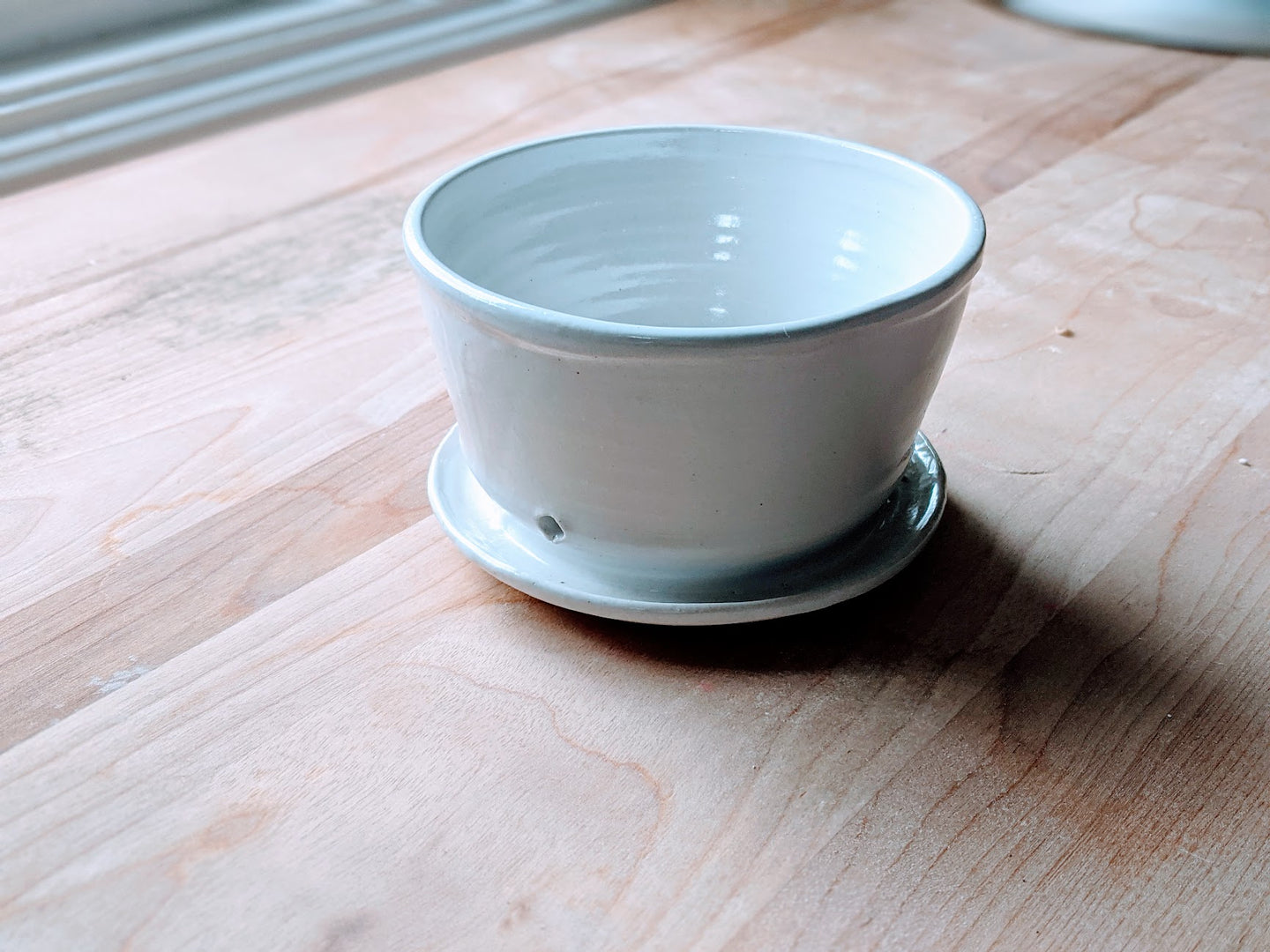 White planter with saucer